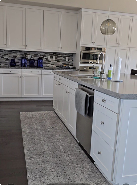 White kitchen cabinets and countertops after deep cleaning