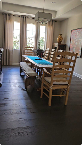 Dining area with wood floors cleaned end to end